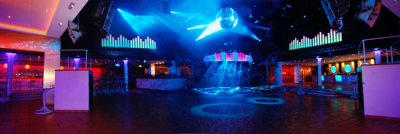 The main room at Space Ibiza illuminated in blue and red
